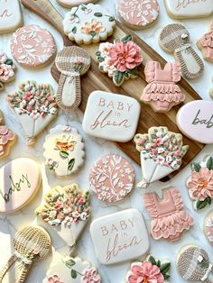 baby shower cookies are laid out on a table