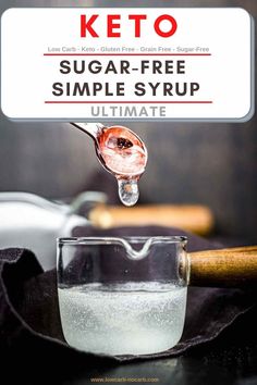 the keto sugar - free simple syrup is being poured into a glass with ice