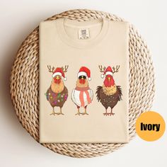 "Cute Christmas Chickens Shirt | Christmas Farm Animal Shirt | Womens Christmas Chicken Shirt| Holiday Shirt Matching Sweatshirt: https://printworkshopcompany.etsy.com/listing/1601330604/cute-christmas-chickens-sweatshirt ** HOW TO ORDER 1. Check our photos for sizing and color options.  2. Select your size and color from the drop-down menus.  3. Click \"ADD TO CART\" to add the shirt to your cart. 4. Click \"PROCEED TO CHECKOUT\" to purchase your shirt. ** VIP Email List Be sure to join our VIP Christmas Chicken, Chicken Shirt, Christmas Farm, Chicken Shirts, Womens Christmas, Matching Sweatshirts, Holiday Shirt, Holiday Shirts, Animal Shirts