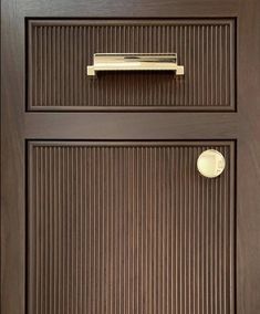 a close up of a door with a handle on it's side and the bottom panel