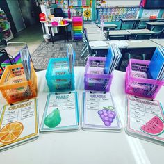 four shopping baskets are lined up on a table