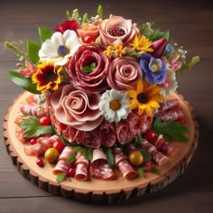 a bouquet of flowers is sitting on top of a piece of wood that has been cut into smaller pieces