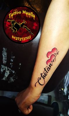 a person with a tattoo on their arm that says tattoosmafia and has hearts in it