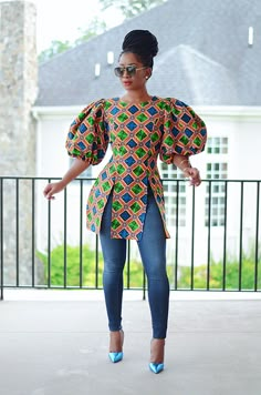 FINAL SALE/ NO RETURNS Beautiful Ankara print Top Statement puff sleeve (See Video) Fabric is 100% cotton with no stretch. Zipper in the back.  *Authentic African fabric. Hand Made. Gold belt in video Not Included *Please note that pattern placement may    vary slightly with each piece. *Color may vary slightly due to lighting . Model is 5'5 and is wearing a Small. Size up if you fall in between sizes. Size Chart XS: US 2 (Bust 32, Waist 25, Hip 34)  Small: US 4/6 (Bust 36, Waist 28, Hip 38) Med Casual Ankara Blouses For Women, Ankara Puff Sleeve Top, Ankara Tops Blouses With Jeans Classy, African Design Tops, Fitted Multicolor Blouse With Balloon Sleeves, Multicolor Fitted Blouse With Balloon Sleeves, Fitted Multicolor Balloon Sleeve Blouse, Multicolor Cotton Puff Sleeve Top, Printed Cotton Puff Sleeve Blouse