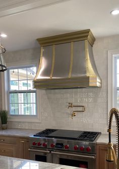 a stove top oven sitting inside of a kitchen