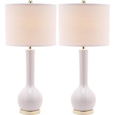 two white table lamps with beige shades on them