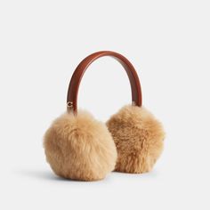 Perfect for ski days and city adventures these warm earmuffs feature super soft long-haired shearling. The smooth leather headband is accented with our Signature for a heritage touch. | Coach Shearling Earmuffs - Women's - 1941 Saddle Signature For A, Ski Headband, Coach Scarf, Leather Headband, Leather Headbands, Coach Belt, Chic Gifts, Old Money Aesthetic, Monogrammed Items