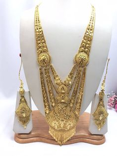 Handmade Indian Jewelry Asian Wedding Bridal Jewellery Party Ethnic Wear 22ct Gold Plated Bridal Necklace Set Rani Haar Bridal Jewellery Set  PLEASE NOTE, This Item Is Not Real Gold .Only Good Quality Gold Plated Jewellery .it is Artificial Jewellery.  It is a perfect match with formal attire on special occasions or with casual wearing.  Slight Colour variations possible due to difference in screen and photograph Care instructions Keep Jewellery away from direct heat, water, perfumes, deodorants Luxury 22k Gold Jewelry With Zari Work, Bollywood Style Yellow Gold Bridal Necklace For Diwali, Gold Bridal Sets With Cutdana For Festivities, Festive Gold Bridal Set With Cutdana, Festive Bollywood Bridal Necklace In Yellow Gold, Traditional Gold Bridal Necklace For Wedding, Traditional Gold Wear With Intricate Design, Gold Traditional Wear With Intricate Design, Traditional Gold Bridal Sets For Wedding