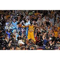 an image of a basketball player celebrating with confetti in front of the crowd