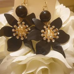 Floral Shaped With Rhinestone Accents Puerced Earrings. Black Jeweled Earrings For Party, Black Jeweled Party Earrings, Elegant Rhinestone Flower Earrings For Party, Glamorous Black Crystal Earrings With Rhinestones, Elegant Black Flower Earrings For Party, Glamorous Black Crystal Rhinestone Earrings, Gift Black Earrings With Rhinestones, Black Earrings With Rhinestones For Gift, Elegant Black Dangle Flower Earrings