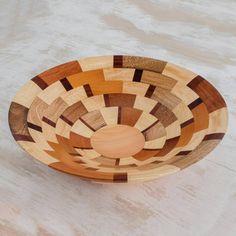 a wooden bowl sitting on top of a table