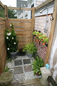 a small garden with potted plants in it