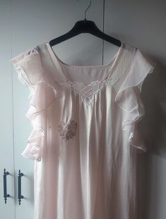 Vintage clothing, very light lavender pink nylon nightgown white lace neckline Dimensions were taken while they were straight. don't forget to double between the armpit to armpit about 22" doubled 44" waist 22" hips 23" length: 53- 54"" 135cm Material: polyester mix. no tag Condition: Used item. good conditon, There is wear on the right breast, sequin lace flower applique was sewn on it by me. The interior can be seen in the photos. There are slight thread pulls on the fabric. armholes are much Pink Ruffle Dress For Bedtime, Feminine Sleeveless Sleepwear For Wedding Night, Delicate Sleeveless Sleepwear For Wedding Night, Feminine Pink Nightgown, Pink Feminine Nightgown, Feminine Ruffled Sleepwear, Vintage Pink Sleeveless Nightgown, Pink Sleeveless Vintage Nightgown, Sleeveless Ruffled Sleepwear For Wedding Night