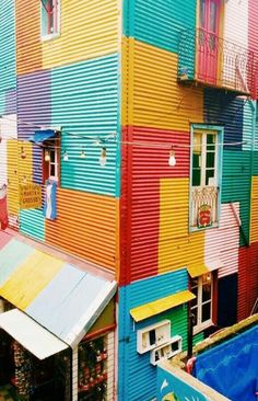 multicolored building with lots of windows and balconies