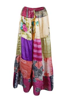 Add a pop of seasonal color to your wardrobe with this eye-catching flared maxi skirt! Made from upcycled saree fabric in a vibrant blend of Pink, Multi bold floral designs, and multi-hued patterns, each skirt is a unique statement piece. The ankle-length flowy silhouette and adjustable drawstring waist ensure both comfort and style, making it perfect for anything from farmer’s market strolls to beachside festival twirls. Crafted with sustainability in mind, this eco-friendly, boho-chic skirt ef Beach Patchwork Maxi Skirt, Patchwork Maxi Skirt For Beach, Multicolor Floral Patchwork Maxi Skirt, Multicolor Patchwork Maxi Skirt For Festivals, Multicolor Floral Patchwork Tiered Maxi Skirt, Bohemian Multicolor Skirt For Festivals, Bohemian Multicolor Festival Skirt, Multicolor Patchwork Maxi Skirt For Beach, Hippie Multicolor Patchwork Maxi Skirt