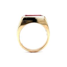 This sleek and modern cocktail ring features a 2.94 carat red garnet in high polished 14 karat yellow gold. The scintillating garnet has a rich pinot noir hue and is bezel set at the face of the ring. The fashionable band features an angular and boxy profile that reaches nearly 5mm above the finger. From the secure gemstone setting to the crisp design, this one of a kind right hand ring is a modern treasure! Classic Formal Birthstone Ring With Smooth Bezel, Modern Ruby Ring With Polished Finish, Modern Gold Ruby Ring With Polished Finish, Formal Red Birthstone Ring With Polished Finish, Formal Red Polished Birthstone Ring, Classic Garnet Signet Ring For Formal Occasions, Classic Red Signet Ring For Formal Occasions, Classic Red Birthstone Ring With Polished Finish, Ruby Signet Ring With Bezel Setting For Formal Occasions