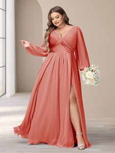 a woman in an orange long sleeved bridesmaid dress with a slited leg