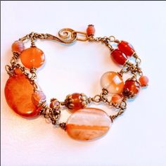 This Brand New Handcrafted Bracelet Is Beautiful! There Are Orange Carnelian Gemstone Beads And Gold Accents That Have Been Wire Wrapped Together. Measures 8 3/4 Inches Long. I Can’t Change The Length On This Bracelet. Comes With Organza Gift Bag. Bracelets Fall, Orange Carnelian, Handcrafted Bracelets, Gemstone Beaded Bracelets, Hand Crafted Jewelry, Long I, Organza Gift Bags, Crafted Jewelry, Gold Accents