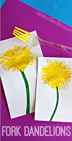 two dandelions made out of construction paper on top of each other with forks