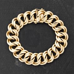 Bold and wide on the wrist, but the flat double links sit nice and low on the wrist, making wearing this bold and hefty bracelet so easy to wear! Bold enough to be worn on its own, yet will stack perfectly with other bracelets, watches, or bangles. 18kt yellow gold French hallmarks Measures 7" in length Modern Chunky Link Bracelets, Elegant Chunky Cuban Link Jewelry, Modern Chunky Link Bracelet, Modern Chunky Oval Link Bracelets, Chunky Chain Link Jewelry For Formal Occasions, Formal Chunky Chain Link Jewelry, Elegant Bracelet With Chunky Cuban Link Chain, Elegant Chunky Oval Link Bracelets, Elegant Chunky Oval Link Bracelet