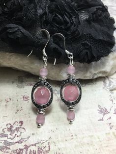 "So Delicate And Pretty These Pink Cats Eye Earrings. Made With, 4mm. Round Matte Pink Cats Eye Stone, 8mm Faceted Round Pink Cats Eye Stones, Antique Silver Plated Ovals, Sterling Silver French Hook Ear Wires And Silver Plated Ball Head Pins. If You Have An Idea For Another Stone Please Let Me Know. Any Item In My Shop Can Be Altered Or Substituted. Cat's Eye acts to stimulate intuition and to enhance awareness. It is a grounding stone that provides a very effective protective energy. Cat's Eye Spiritual Nickel-free Pink Jewelry, Pink Hypoallergenic Sterling Silver Hoop Earrings, Pink Sterling Silver Hypoallergenic Hoop Earrings, Silver Spiritual Crystal Earrings Nickel Free, Silver Nickel-free Spiritual Crystal Earrings, Nickel-free Silver Crystal Earrings For Spiritual Use, Handmade Spiritual Pink Earrings, Handmade Pink Spiritual Earrings, Pink Sterling Silver Earrings For Pierced Ears