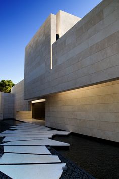 the exterior of a modern building with concrete walls