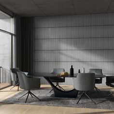 a dining room table with chairs and a wine bottle on the table next to it