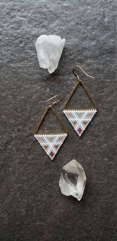 Spring brings color back into our lives. Pretty little spring colors in sparkling silk beads really pop against the gray Aurora Borealis finished beads. Simple white outlines it all. Woven onto gold plated triangles and finished with 14k gold filled ear wires. Made to order. Not available for wholesale. Adjustable Triangle Beaded Earrings, Minimalist White Beaded Earrings With Tiny Beads, Minimalist White Beaded Dangle Earrings, Handmade White Triangle Beaded Earrings, Triangle Beaded Earrings For Gifts, Beaded Triangle Earrings For Gifts, Gold Triangle Beaded Bohemian Earrings, Minimalist White Beaded Drop Earrings, Minimalist White Earrings With Tiny Beads