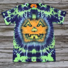 a tie - dyed t - shirt with an orange and blue design