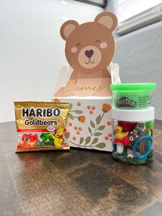 an assortment of toys and candy on a table