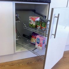 a refrigerator door is open with food in it