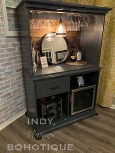 a small bar with wine glasses and bottles on it in front of a brick wall