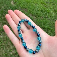 This Is A Cute Clear Shiny Light Blue Glass Beaded Bracelet With Lava Pressed Blue Hematite, And Blue Hematite Beads. This Bracelet Is Simple And Elegant. The Beads Are Very Pretty, Especially In The Sun. This Bracelet Would Go Well With Anything! This Bracelet Is Fitted So It Won't Move Around Much During Wear. Bundles And Reasonable Offers Welcome! Gorgeous, Blue, Light Blue, Shiny, Iridescent, Clear, Glass Beads, Glass, Glass Beaded, Elegant, Casual, Simple, Chic, Cute, Adorable, Coastal, Bea Blue Beaded Stretch Bracelet With Round Beads, Blue Polished Beads Bracelets For Gift, Adjustable Blue Stretch Bracelet With Gemstone Beads, Blue Gemstone Beads Stretch Bracelet, Blue Crystal Bracelet With Polished Beads For Gift, Adjustable Blue Gemstone Beads Stretch Bracelet, Adjustable Blue Beaded Bracelets With Gemstones, Blue Crystal Bracelet With Polished Beads As Gift, Adjustable Blue Gemstone Beaded Bracelets