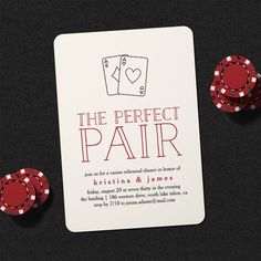 the perfect pair wedding card and poker chips on a black table with red dices