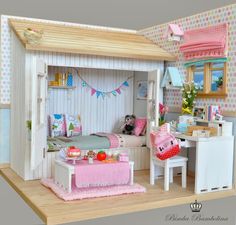 a doll house with furniture and accessories in it