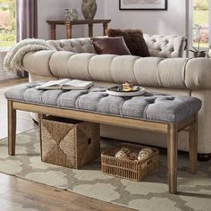 a living room scene with focus on the couch and coffee table in the foreground