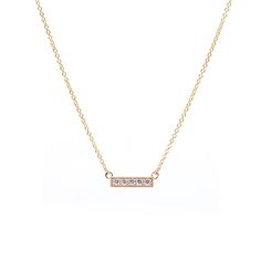 The Heirloom Bar Necklace from The GATES Collection by M. Flynn features 5 diamonds set in 14K yellow gold. Wear this simple and timeless necklace alone or layer with a few other pieces. 
The GATES Collection by M. Flynn is a jewlery collaboration with interior designer and blogger, Erin Gates. Gold Minimalist Diamond Bar Necklace, Minimalist Yellow Gold Bar Necklace With Diamond Accents, Everyday Yellow Gold Diamond Bar Necklace, Minimalist Gold Diamond Bar Necklace, Minimalist Bar Necklace With Single Cut Diamonds For Gift, Everyday Gold Bar Necklace With Diamond, Minimalist Gold Diamond Necklace With Si Clarity, Classic Bar Necklace With Diamond Accents For Gifts, Gold Bar Necklace With Single Cut Diamonds As Gift