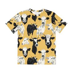 Embrace the rustic beauty of the countryside with our Pastoral Charm Cow Print All-Over Tee. Adorned with an array of cow portraits set against a warm, mustard-yellow backdrop, this tee is a nod to pastoral bliss and farmyard favorites. It's the perfect pick for: Adding a touch of whimsical country charm to your wardrobe 🐄 Soft, breathable fabric that ensures comfort whether you're out in the field or in the city 🌾 A playful, yet stylish design that's sure to start conversations and bring smil Yellow Printed T-shirt For Fall, Fall Yellow Printed T-shirt, Vibrant Clothing, Yellow Backdrop, Rural Lifestyle, Cow Face, Spread Positivity, Unique Accessories, Country Charm