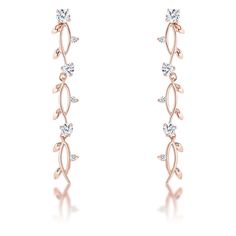 These elegant dangling vine earrings are the perfect complement to your favorite evening look. Plated with genuine rose gold these dainty feminine earrings add sparkle with a natural timeless look. Setting Type: Prong Stone Size: 4mm Stone Cut: Round Carat Weight: 1.1 Ct Contemporary Diamond Ring, Rose Gold Dangle Earrings, Vine Earrings, Rose Gold Drop Earrings, Feminine Earrings, Pink Diamond Ring, Vine Design, Diamond Drops, Diamond Drop Earrings