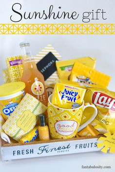 a basket filled with lots of different types of food and drinks on top of a table