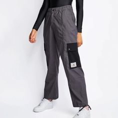 NIKE NIKE Women's AIR Jordan Essential Utility Pants. NEW WITH TAGS. 100% Authentic; 100% COMFORTABLE!! STYLE: DD7006     COLOR: 082     SIZE: PLUS 1X     RETAIL PRICE: $120.00 EVERYDAY STAPLE WITH CONVENIENT STORAGE. Head out for the day in pants that can do it all. Lightweight and versatile, the Jordan Essentials Pants come with pockets that close in a snap. Ties at the leg openings let you customize the fit. Benefits Woven, water-repellent fabric is lightweight and durable. Snap back pocket a Nike Cargo Bottoms, Nike Athleisure Cargo Pants With Cargo Pockets, Nike Cargo Pants With Cargo Pockets Athleisure Style, Nike Sporty Cargo Pants, Nike Sporty Cargo Pants With Pockets, Nike Athleisure Cargo Pants With Pockets, Nike Cargo Pants For Sports, Nike Cargo Pants For Athleisure, Nike Sportswear Cargo Pants With Pockets