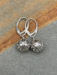 Sterling silver leverback Earrings. The Bali sterling silver earrings are handmade. The beads have a pattern of lines and dots they are 10 mm wide. The earrings are 1 3/16 inches (3.0 cm) in length. Choose earring wires from the drop-down menu. The pictures are enlarged to show detail. The earrings ship in a small organza bag inside a gift box, ready to give... or keep! To see more WireAndPearl sterling silver earrings, please visit: https://www.etsy.com/shop/WireAndPearl?section_id=18630564 Als Silver Lever Back Jewelry Gift, Silver Lever Back Jewelry As Gift, Silver Lever Back Jewelry For Gift, Dainty Silver Earrings With Round Beads, Adjustable Silver Jewelry With Lever Back, Silver Drop Earrings With Lever Back, Silver Round Earrings With Lever Back, Silver Earrings With Lever Back Ear Wires For Gifts, Silver Round Lever Back Earrings