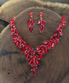 "These fun and stylish red large crystal rhinestone necklace and earrings are a great statement piece! Pageant, prom, or bridal!  Necklace Size: 16\" and 3\" extension Decor Dangle Length: 2\" Size of earrings: 1.75\" Long.  Color: red crystals Base metal color: gold Looking for a matching bracelet? https://www.etsy.com/listing/606549267/red-bracelet-red-rhinestone-bracelet-red?ref=shop_home_active_8 https://www.etsy.com/listing/538148439/red-crystal-bracelet-large-crystal?ref=shop_home_active_3 Red And Pink Jewelry, Red Quince Necklace, Red Prom Accessories, Red Prom Jewelry, Red Orange Outfit, Red Jewellery Set, Red And Gold Jewelry, Red Jewelry Necklace, Choker Necklace Outfit