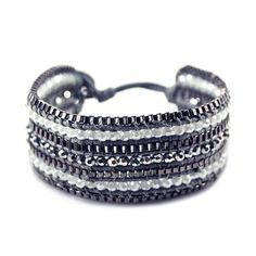 The intricate weaving of this shiny bracelet is like nothing you've seen before. Inspired on the juxtaposition of the bling and the matte, this piece is the ideal hippie chic yet classy weekend look.Bracelet Details: Chic metallic button closure Adjustable with two size options Hippie Size & Fit:L x W: 8 x 1 Metal Wrap Bracelet For Parties, Metal Wrap Bracelet For Party, Trendy Silver Braided Metal Bracelet, Trendy Silver Metal Braided Bracelets, Adjustable Silver Metal Braided Bracelet, Trendy Adjustable Bracelets For Party, Trendy Woven Braided Bracelet, Trendy Handmade Wrap Bracelet For Party, Adjustable Bangle Wrap Bracelet For Party