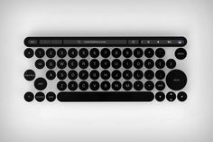 a black and white photo of an old fashioned computer keyboard with the keys turned backwards