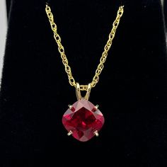 Beautiful Ruby & 14k Gold Necklace  * 5ct Cushion Cut Ruby measure 10mm x 10mm * 14k Yellow Gold * 16" or 18" Chain included - Select your Length Hallmarked & Gift Ready!    Matching Earrings and Ring available - message me for handling times and current gold pricing.  This Ruby is laboratory grown and is identical to the natural in every way, including, Chemistry, Composition & Hardness.  TIMELESS, BEAUTIFUL & UNIQUE FINE ART JEWELRY Luxury Red Lab-created Ruby Necklace, Luxury Lab-created Ruby Necklace Gift, Ruby Pendant Necklace, Ruby Necklace Pendant, Ruby Pendant, Fine Art Jewelry, Ruby Necklace, 14k Gold Necklace, July Birthstone