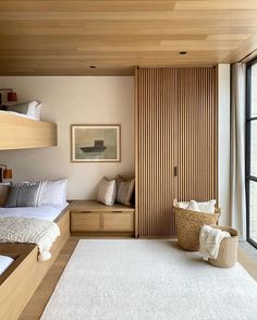 a bedroom with bunk beds and white rugs