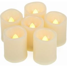 six white candles sitting next to each other on top of a white surface with the words 2 day shipping written below them