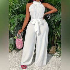 This Vibrant Solid Color Halter Neck Jumpsuit Is An Elegant Sleeveless, Belted, Wide Leg Jumpsuit That Is Comfortable And Perfect For Spring And Summer. It Is An Essential Addition To Any Woman's Stylish Warm Weather Wardrobe. White / Xl(12) Bust: 39.8-42.2in Waist: 31.9-34.3in Hips: 41.8-44.1in Material: Polyester Belt: Yes Pattern: Solid Color Sheer: Semi-Sheer Season: All Operation Instruction: Machine Wash, Do Not Dry Clean Style: Casual Fabric Elasticity: No Elasticity Weaving Method: Woven White Halter Jumpsuit, Halter Neck Jumpsuit, Halter Jumpsuit, Jumpsuit Elegant, Wide Leg Jumpsuit, Halter Neck, Stylish Women, Warm Weather, Pant Jumpsuit