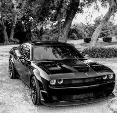 a black and white photo of a sports car